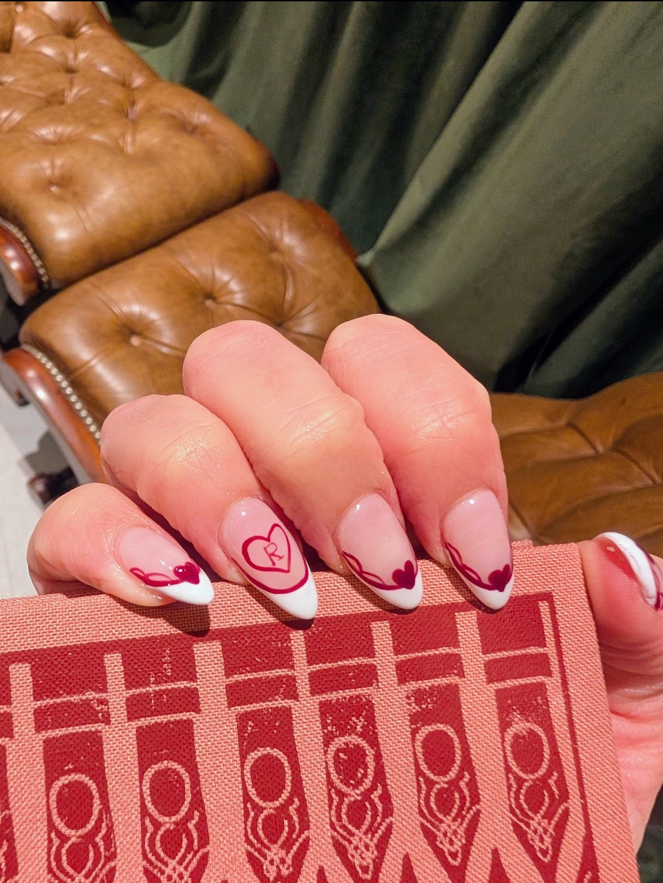 Almond nails with red heart French tips