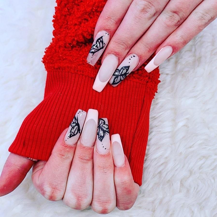 Long nude coffin nails with black butterfly line art and French tips