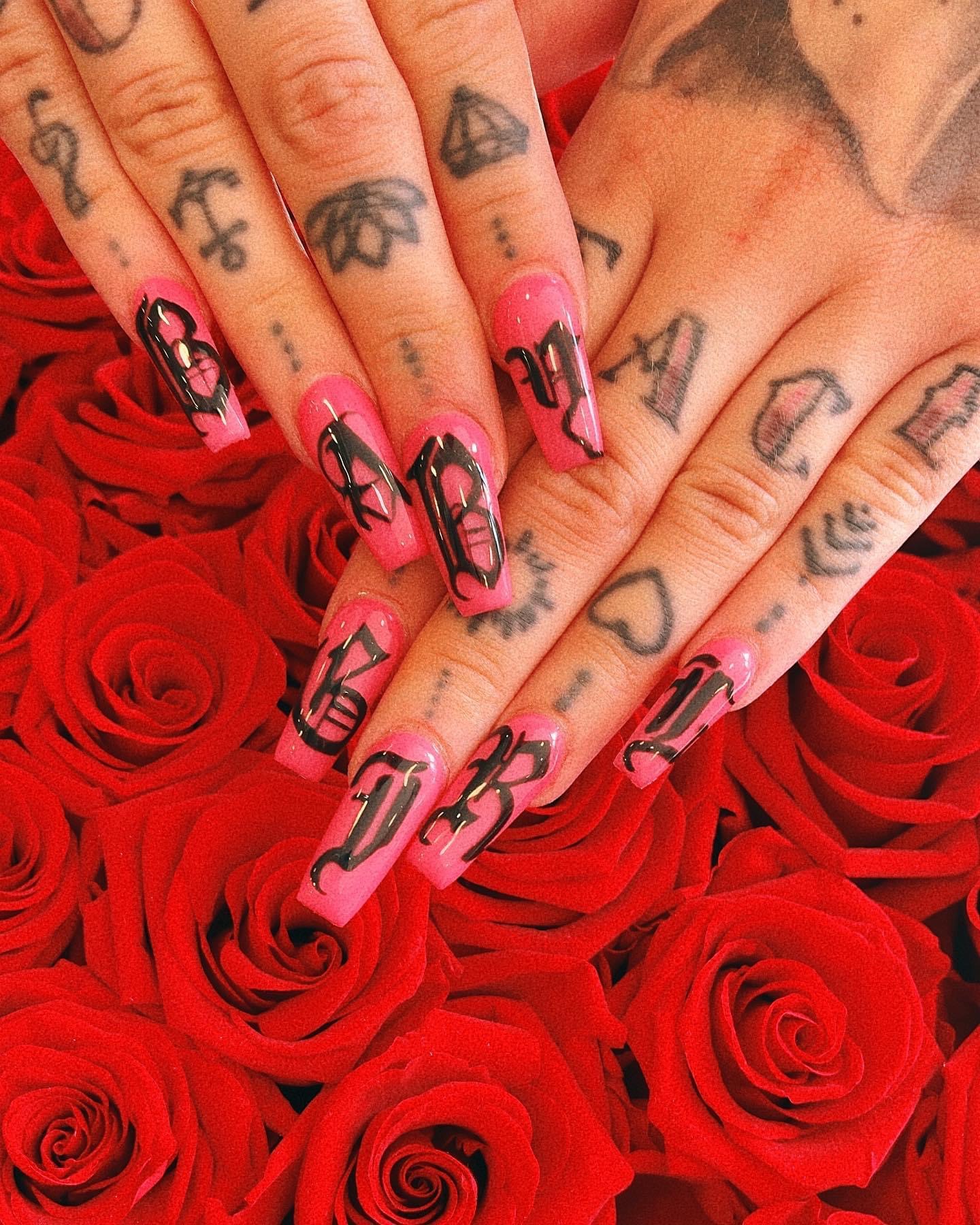 Pink coffin nails with black gothic lettering