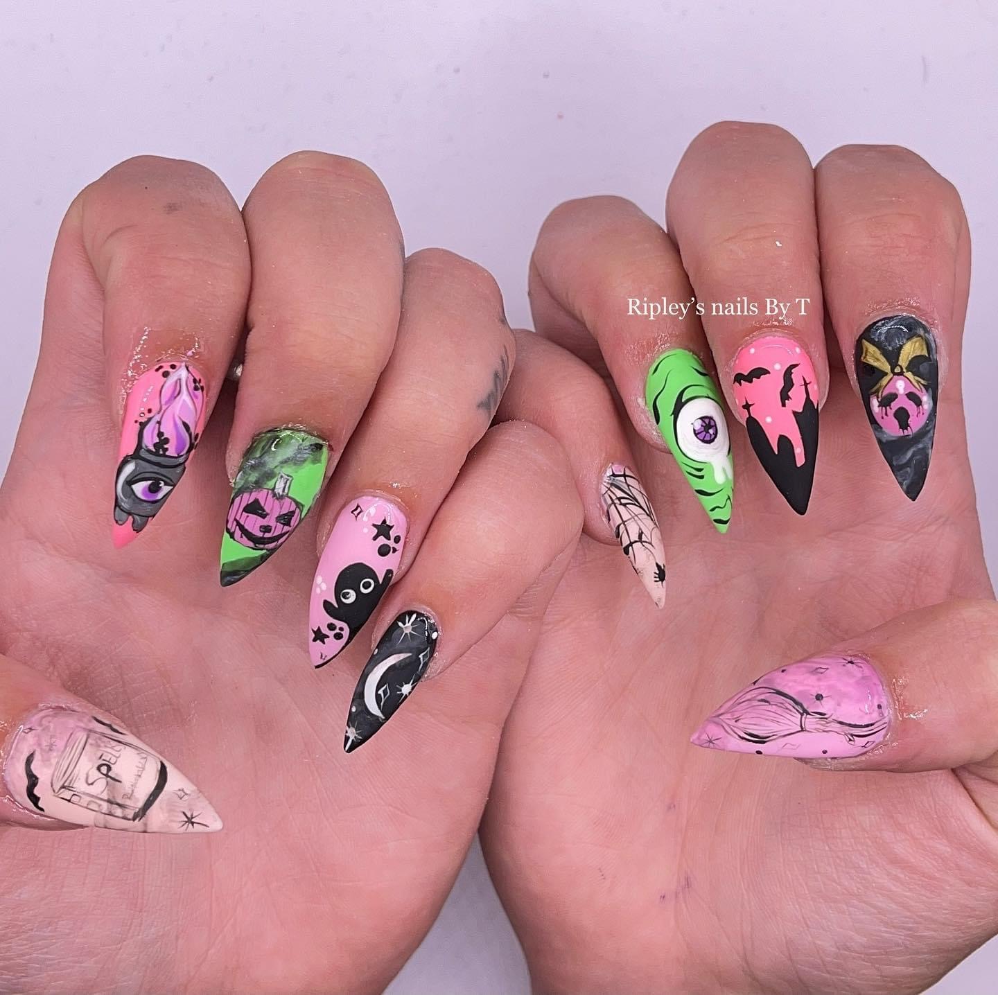 Halloween stiletto nail art with pumpkins, bats and ghosts